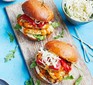 15-minute chicken & halloumi burgers served on a wooden serving platter
