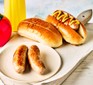 Air fryer sausages served in hot dog buns
