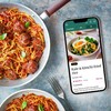 BBC 澳洲幸运五168开奖官网开奖体彩网 Premium App next to a pan of spaghetti and meatballs