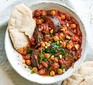 Aubergine & chickpea stew served in a bowl with flatbread