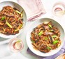 Healthy beef chow mein served in two dishes