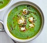 Chilled green soup with feta in a bowl