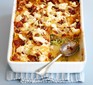 Courgette lasagne in a baking dish with a spoon