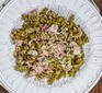 Pea fusilli with ham & mustard sauce served on a plate