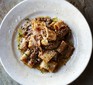 Venetian duck ragu with pasta on a white plate