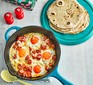 Flatbreads with brunch-style eggs served in a frying pan