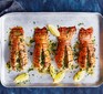 Grilled lobster tails with lemon & herb butter served on a baking tray