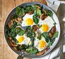 Mushroom, eggs and kale in a pan