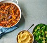 One-pan beef stew in a large casserole dish with vegetable mash