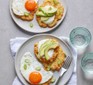 Potato fritters topped with egg, soured cream and avocado