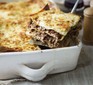 Lasagne in a dish with slice out