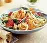 Chilli prawn and garlic linguine in a bowl with tomatoes