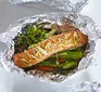 Teriyaki salmon with vegetables in foil parcels