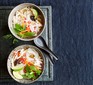 Slow cooker turkey pho served in two bowls