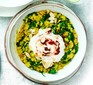 Spinach dhal with harissa yogurt served in a bowl