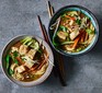 Two bowls of vegan ramen with chopsticks