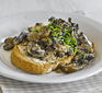 Creamy mustard mushrooms on toast, topped with chives